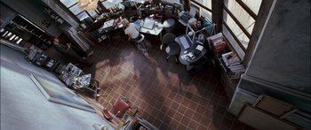 Movie still from “Stay” (2005), directed by Marc Forster – An overhead view of a person working at a computer desk; Wide shot, Overhead angle