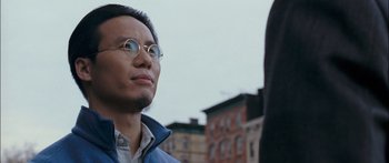 Movie still from “Stay” (2005), directed by Marc Forster – A person wearing glasses and a jacket; Close Up shot, Over the shoulder angle