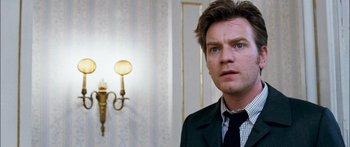 Movie still from “Stay” (2005), directed by Marc Forster – A person wearing a suit and a tie; Close Up shot, Low angle