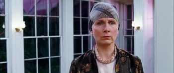 Movie still from “Stay” (2005), directed by Marc Forster – An older woman wearing a head scarf and a jacket; Close Up shot, Low angle