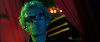 Movie still from “Stay” (2005), directed by Marc Forster – A person wearing glasses and a jacket; Close Up shot, Low angle