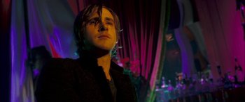 Movie still from “Stay” (2005), directed by Marc Forster – A man with long hair is standing in a dark room; Close Up shot, Low angle
