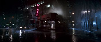Movie still from “Stay” (2005), directed by Marc Forster – A diner sign lit up at night in the rain; Extreme Wide shot, Low angle