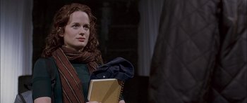 Movie still from “Stay” (2005), directed by Marc Forster – A woman holding a book and a notebook; Medium shot, Over the shoulder angle