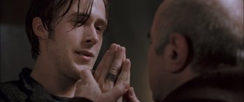 Movie still from “Stay” (2005), directed by Marc Forster – A person with their hands together; Close Up shot, Over the shoulder angle
