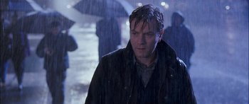 Movie still from “Stay” (2005), directed by Marc Forster – A man walking in the rain holding an umbrella; Close Up shot, Low angle