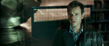 Movie still from “Stay” (2005), directed by Marc Forster – A man that is standing in the dark; Close Up shot, Over the shoulder angle