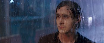 Movie still from “Stay” (2005), directed by Marc Forster – A man looking out of a window at the rain; Close Up shot, Over the shoulder angle
