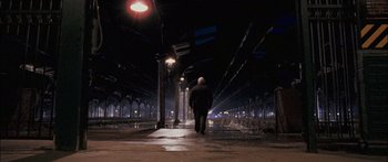 Movie still from “Stay” (2005), directed by Marc Forster – An old man is walking alone in a train station at night; Extreme Wide shot, Low angle