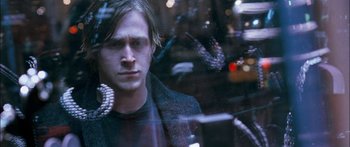 Movie still from “Stay” (2005), directed by Marc Forster – A man looking out of a car window at night; Close Up shot, Over the shoulder angle