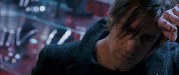 Movie still from “Stay” (2005), directed by Marc Forster – A man's face in a dark room; Close Up shot, Over the shoulder angle