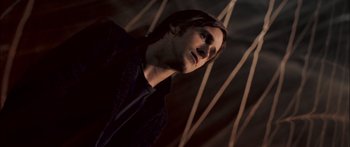 Movie still from “Stay” (2005), directed by Marc Forster – A man with long dark hair is looking up; Close Up shot, Low angle