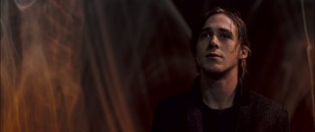 Movie still from “Stay” (2005), directed by Marc Forster – A man standing in front of a curtain; Close Up shot, Low angle