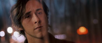 Movie still from “Stay” (2005), directed by Marc Forster – A man's face in front of blurry lights; Close Up shot, Over the shoulder angle