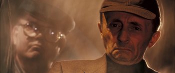 Movie still from “Stay” (2005), directed by Marc Forster – An old man wearing a suit and a hat; Close Up shot, Low angle