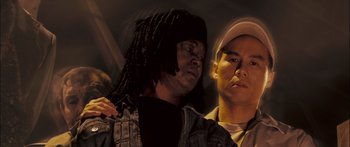 Movie still from “Stay” (2005), directed by Marc Forster – Two men standing next to each other in front of a wall; Close Up shot, Low angle