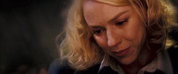 Movie still from “Stay” (2005), directed by Marc Forster – A woman with blonde hair looking down; Close Up shot, Over the shoulder angle