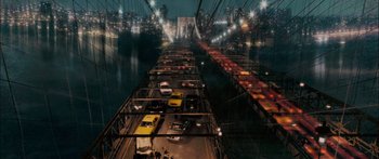 Movie still from “Stay” (2005), directed by Marc Forster – A view of a bridge at night with cars parked on it; Extreme Wide shot, Overhead angle