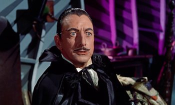 Movie still from “Babes in Toyland” (1961), directed by Jack Donohue – A person wearing a suit and tie; Close Up shot, Low angle