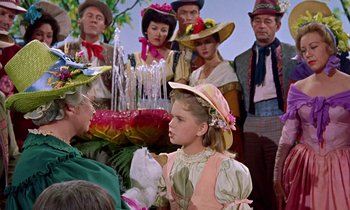 Movie still from “Babes in Toyland” (1961), directed by Jack Donohue – A group of people dressed up in costumes; Medium shot, Over the shoulder angle