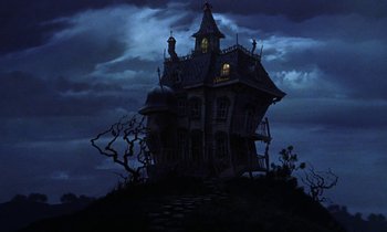 Movie still from “Babes in Toyland” (1961), directed by Jack Donohue – A painting of an old house on a hill at night; Extreme Wide shot, Low angle