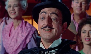Movie still from “Babes in Toyland” (1961), directed by Jack Donohue – A person wearing a top hat; Close Up shot, Low angle