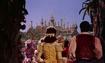 Movie still from “Babes in Toyland” (1961), directed by Jack Donohue – A group of people standing in front of a building; Wide shot, Low angle