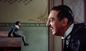 Movie still from “Babes in Toyland” (1961), directed by Jack Donohue – A man's face and a woman's face; Medium shot, Low angle