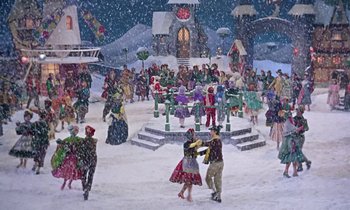 Movie still from “Babes in Toyland” (1961), directed by Jack Donohue – A group of people standing in the middle of a snow covered field; Extreme Wide shot, High angle