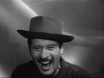 Movie still from “Baby Doll” (1956), directed by Elia Kazan – A black and white photo of a man wearing a hat; Close Up shot, Low angle
