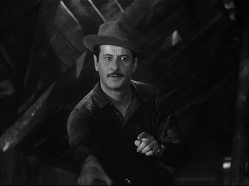 Movie still from “Baby Doll” (1956), directed by Elia Kazan – A black and white photo of a man wearing a hat; Close Up shot, Low angle