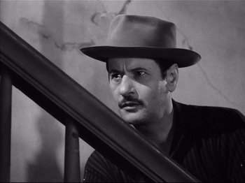 Movie still from “Baby Doll” (1956), directed by Elia Kazan – A black and white photo of a man wearing a hat; Close Up shot, Low angle