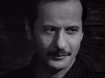 Movie still from “Baby Doll” (1956), directed by Elia Kazan – Black and white photograph of a man with a mustache; Close Up shot, Low angle