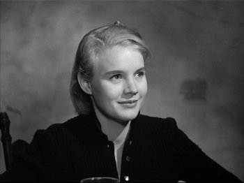 Movie still from “Baby Doll” (1956), directed by Elia Kazan – A black - and - white photo of a woman with blonde hair; Close Up shot, High angle