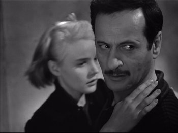 Movie still from “Baby Doll” (1956), directed by Elia Kazan – A man and a woman in a black and white photo; Close Up shot, Over the shoulder angle