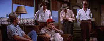 Movie still from “Bad Day at Black Rock” (1955), directed by John Sturges – A group of men sitting in a room; Medium shot, High angle