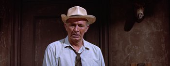 Movie still from “Bad Day at Black Rock” (1955), directed by John Sturges – An older man wearing a hat and a tie; Close Up shot, Low angle