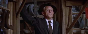 Movie still from “Bad Day at Black Rock” (1955), directed by John Sturges – An older man wearing a suit and hat; Medium shot, Low angle