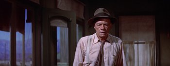 Movie still from “Bad Day at Black Rock” (1955), directed by John Sturges – An older man wearing a hat and suspenders; Medium shot, Low angle