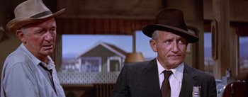 Movie still from “Bad Day at Black Rock” (1955), directed by John Sturges – An older man wearing a suit and a hat; Close Up shot, Low angle