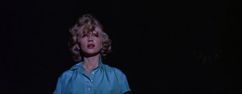 Movie still from “Bad Day at Black Rock” (1955), directed by John Sturges – A woman in a blue shirt is looking up; Close Up shot, Low angle