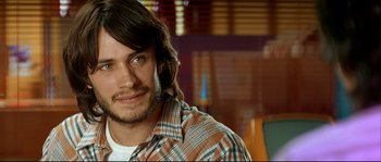 Movie still from “Bad Education” (2004), directed by Pedro Almodóvar – A person wearing a plaid shirt; Close Up shot, Over the shoulder angle