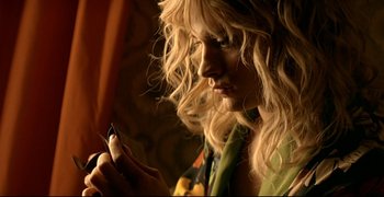 Movie still from “Bad Education” (2004), directed by Pedro Almodóvar – A woman is looking at her cell phone; Close Up shot, Low angle