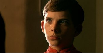 Movie still from “Bad Education” (2004), directed by Pedro Almodóvar – A young boy with a tear in his eye; Close Up shot, Low angle