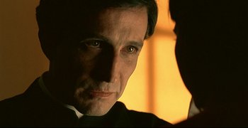 Movie still from “Bad Education” (2004), directed by Pedro Almodóvar – A man's face in a dark room; Close Up shot, Over the shoulder angle