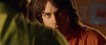 Movie still from “Bad Education” (2004), directed by Pedro Almodóvar – A person with green eyes; Close Up shot, Over the shoulder angle