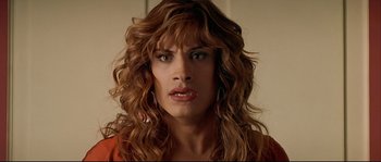 Movie still from “Bad Education” (2004), directed by Pedro Almodóvar – A person with long curly hair; Close Up shot, Overhead angle
