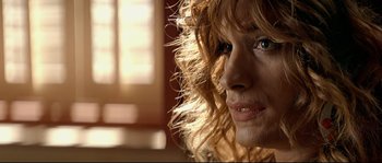 Movie still from “Bad Education” (2004), directed by Pedro Almodóvar – A woman's face in a room with sunlight coming through the window; Extreme Close Up shot, Over the shoulder angle