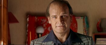 Movie still from “Bad Education” (2004), directed by Pedro Almodóvar – A person wearing a jacket; Close Up shot, Low angle