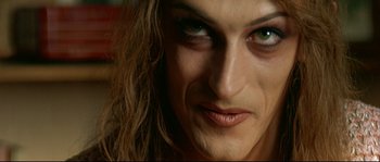 Movie still from “Bad Education” (2004), directed by Pedro Almodóvar – A woman's face with green eyes; Extreme Close Up shot, Overhead angle